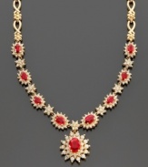 Experience timeless beauty with this lovely necklace featuring oval-cut ruby (4-3/8 ct. t.w.) and round-cut diamond (2-1/3 ct. t.w.) set in 14k gold, from Effy Collection. Approximate length: 18 inches. Approximate drop: 3/4 inch.