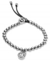 Lock of love. This stretch bracelet from Michael Kors is crafted from silver ion-plated steel and leather with beads and a crystal padlock charm for a whimsical touch. Approximate diameter: 2-1/4 inches. Approximate drop: 1 inch.