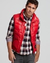 Diesel's down vest is fierce in slick red nylon, featuring a drawstring collar and practical pockets.