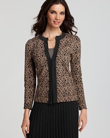 A jeweled neckline glams up this printed cardigan by Jones New York Collection. Pair with a timeless black skirt and pumps for a finished look.