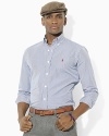 Defined by classic gingham, this trim-fitting sport shirt in crisp cotton poplin is essential for preppy style.