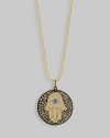 The hamsa, or open hand, a graceful symbol of protection in many cultures, becomes a shimmering necklace, set with diamonds and a single sapphire, on a diamond pavé medallion hanging from a gold ball chain. Diamonds, 0.43 tcw Sapphire, 0.05 ct 14k yellow gold Chain length, about 16 Medallion diameter, about ½ Lobster clasp Imported