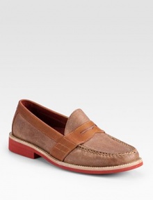 A traditional loafer style is redefined by its contrasts in finely textured leather.Leather upperLeather liningPadded insoleRubber soleImported