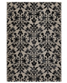 Reflections of Tibet. The Couristan Everest area rug features a beautiful floral pattern in shades of grey and black, crafted from thick-pile polypropylene that imparts a natural appearance and soft, luxurious finish.