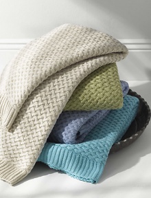 A substantial cotton throw is crafted with a cozy and comfortable basketwoven texture. Ribbed edges50 X 70CottonMachine washImported