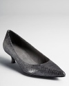 Sweet and low-heeled, Stuart Wetizman's pointed toe pumps work it, in or out of the office.