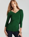 Brimming with graphic edge, a bandage VINCE CAMUTO top strikes at a distance with stacked layers of diagonal stripes.