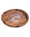 With elegant swooping edges crafted in luxurious acacia wood, this condiment server from Nambe's collection of serveware and serving dishes mimics the grace and beauty of a butterfly in flight. A smart sectioned bowl, sculpted in gleaming crystal, maintains an elegant visual, whatever you're serving.