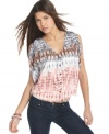 Sport perfect tie-dye color blend by day with this floaty, split sleeve blouse from Ali & Kris!