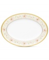 East meets West in the ornate Blooming Splendor oval platter by Noritake. A Japanese-inspired pattern with raised dots encircles intricate florals rooted in white bone china.