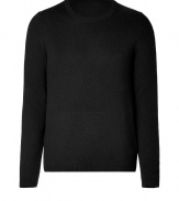 Elegant pullover in a fine black wool and cashmere blend - Classic crew neck style - The cut is slim and straight with long sleeves - A casual classy basic for everyday wear - Very light, soft material - Small ribbed cuffs on the sleeves and hem - A classic favorite piece that works with all types of pants for leisure and business