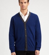 A smart, preppy layer in soft merino wool with an easy button front and striking contrast border.V-neckButton frontLong sleevesMerino woolHand washImported