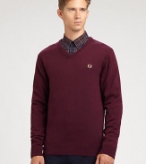 A practical pullover sweater with collegiate-inspired style effortlessly shaped in a warm blend of merino wool and cotton.V-neckRibbed knit collar, sleeves and hem54% merino wool/46% cottonDry cleanImported