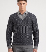 A well-knitted wool pullover sweater is printed in a textural, geometric pattern for a look that exudes modern elegance.V-neckRibbed knit cuffs and hemWoolMachine washImported