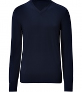 Must-have piece for fall, this classic navy v-neck pullover is a versatile favorite of the season - Made of pure wool for optimal warmth and comfort - Long, slender sleeves, small v-neck and moderately long hem - Looks great solo or as a laying piece - Pair with jeans and khakis for causal, polished looks