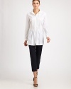 Crisp woven cotton, tailored in a flattering silhouette featuring delicate front pleats.Point collarButton frontPleated frontLong sleeves with button cuffsAbout 29 from shoulder to hem83% cotton/14% polyamide/3% elastaneDry cleanMade in Italy of imported fabric Model shown is 5'11 (180cm) wearing US size 4.OUR FIT MODEL RECOMMENDS ordering true size. 