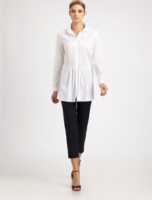 Crisp woven cotton, tailored in a flattering silhouette featuring delicate front pleats.Point collarButton frontPleated frontLong sleeves with button cuffsAbout 29 from shoulder to hem83% cotton/14% polyamide/3% elastaneDry cleanMade in Italy of imported fabric Model shown is 5'11 (180cm) wearing US size 4.OUR FIT MODEL RECOMMENDS ordering true size. 