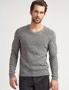 A tweed pattern and classic ribbed trim add texture to this pullover sweater.V-neckRaglan sleevesRibbed trim80% wool/20% polyamideDry cleanImported