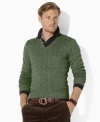 A classic V-neck sweater is cable-knit from the finest tussah silk yarns for lightweight comfort and stylish sophistication.