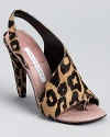 DIANE von FURSTENBERG showcases a unique silhouette with the Morocco sandals, boasting low cut sides, a thong toe, and a bold leopard print in luxe pony hair.