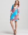 Evoke island chic in this effortless Lilly Pulitzer tunic dress, boasting a vivd coral print for beach-ready style.