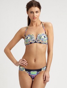 A bold, eclectic print and classic bikini silhouette combine to create an alluring design, including a removable halter strap for style versatility. Removable halter strapBandeau topBack clasp closureSexy, ruched sides on stretch bottomFully lined80% nylon/20% spandexHand washMade in USA