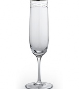 Commemorate a special anniversary with a simply elegant reminder of the time you said, I do. This radiant crystal flute is hand-engraved with interlocking bands that symbolize the rings exchanged between bride and groom. A platinum rim provides a graceful finish.