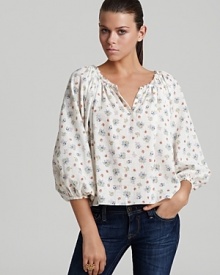 A dainty floral print sweetens up this vintage-inspired Rebecca Taylor blouse, complete with a frayed neckline and blouson sleeves.