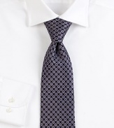 Mini medallion print design defines this handsomely crafted tie of superior Italian silk.SilkDry cleanMade in Italy