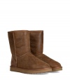 Stylishly distressed and undeniably cozy, these vintage-inspired shearling boots from UGG Australia lend comfort and style to your cold weather look - Round toe, rugged rubber sole, exposed seams, side button detail, contrasting back counter suede panel, cozy shearling lining, weathered finish - Hits above the ankle - Pair with favorite jeans, bright knits, and sporty outerwear