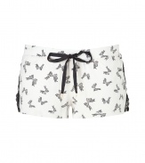 Incredibly comfy and equally sexy, Juicy Coutures lace detailed bow print shorts are a sweet choice for everyday lounging - Drawstring waistband with black tie and gold-toned heart aglets, black side lace inserts with button detail, slit leg - Form-fitting, extra short - Wear with cozy shearling slippers and the matching cami