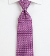 A fine silk tie with a brilliant print that represents the Salvatore Ferragamo aesthetic.SilkDry cleanMade in Italy