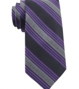 In a traditional stripe pattern, this Calvin Klein skinny tie recalls classic haberdashery style.