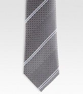 A signature tie handmade from fine Italian silk with diagonal stripes and subtle GG detail. Silk Dry clean Made in Italy 