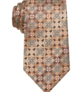 Punch up your wardrobe of solid dress shirts with this medallion-patterned tie from Alfani.