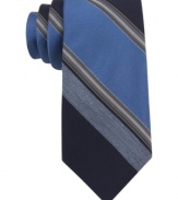 With a cool palette of colors, this Calvin Klein striped skinny tie makes a solid statement.