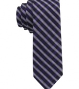 Enter the stripe zone with sleek style. This skinny tie from Calvin Klein lets you power up with a pattern play.