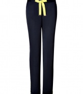 Detailed in super soft navy tumbled satin, Juicy Coutures neon trimmed pants are a sporty choice as comfy as they are chic - Neon lime grosgrain drawstring with gold-toned logo engraved aglets, logo charm, neon lime side trim, slit ankles - Loose fit - Wear with a tissue tee, hoodie and shearling lined boots