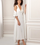 Ballgown beauty with bedroom charm. Elegant rosettes trim this flowing bridal nightgown by Flora Nikrooz.