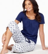 Anchors aweigh! Sail off to sleep with the fun, printed capri pants and cute t-shirt by Nautica.