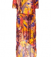 Luxurious and dramatic dress in fine patterned viscose - Designed by the fashion darling Matthew Williamson, know for his spectacular prints - Features a stylish floral pattern in bright orange and indigo - Draped casually with a round neckline, feminine waist belt and sexy, cut-out short sleeves and back - Skirt is floor-length at back and short at front - Chic, modern and glamorous, looks great with peep toe heels when dressed up, or on holiday with metallic flat sandals