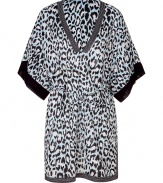 Stylish caftan in fine, light blue cotton - Elegant, on-trend leopard print - Lightweight and fluid, hits above the knee - Stripe trim at deep V-neck and hem - Oversize, elbow-length sleeves - Cinched waist with skinny tie - Chic slits at side - A dream go-to for your next beach getaway - Also works layered over leggings and skinny denim with sandals