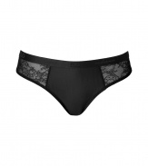 Sexy Brazilian-style thong in fine, black synthetic fiber blend - Especially comfortable, thanks to a generous touch of stretch - Two sheer lace panels at either hip - Medium rise brief is cut moderately high, elongating the leg - Stylish and seductive, ideal for evenings in! - Pair with a matching bra