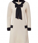 Put a sartorial spin on daytime sophistication in Moschinos sweet-chic two-tone sailor dress - Draped neckline with slit and tie, long sleeves, skirt with side pleating, black trim throughout, hidden back zip - Loosely tailored fit - Wear with patent leather flats and a chain-detailed handbag