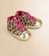 Baby takes a walk on the wild side in these eye-catching, metallic-accented canvas kicks with contrasting laces and leopard print design.Slip-onCanvas upperVelvet liningPolyurethane solePadded insoleImported