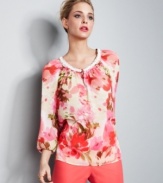 Charter Club's petite top abounds with seasonal inspiration, like bright, charismatic colors and a watercolor-inspired floral print. A beaded neckline is an elegant finishing touch.