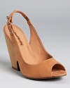 In matte nubuck leather, these undeniably chic Madison Harding wedges offer understated style.