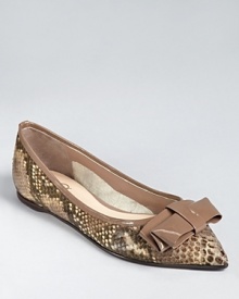 In soft taupe, these Delman flats shine in snakeskin printed leather and glossy patent trim.