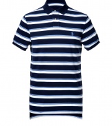 Detailed in ultra soft cotton pique, this striped polo is the epitome of the timeless classic Ralph Lauren look - Small navy collar, button placket, short sleeves, navy trim, embroidered polo player at chest, slit sides, high-low hemline - Classic cut - Wear with everything from jeans and sneakers to colored cords and loafers