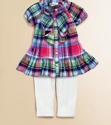 An adorable cotton plaid top, adorned with ruffle trim along the placket and collar, is paired with pointelle leggings for an unbeatable match. Shirt Ruffled collarShort raglan sleevesButton frontRuffle hem Leggings Elastic waistbandPicot trim along hemCottonMachine washImported Please note: Number of buttons may vary depending on size ordered. Additional InformationKid's Apparel Size Guide 